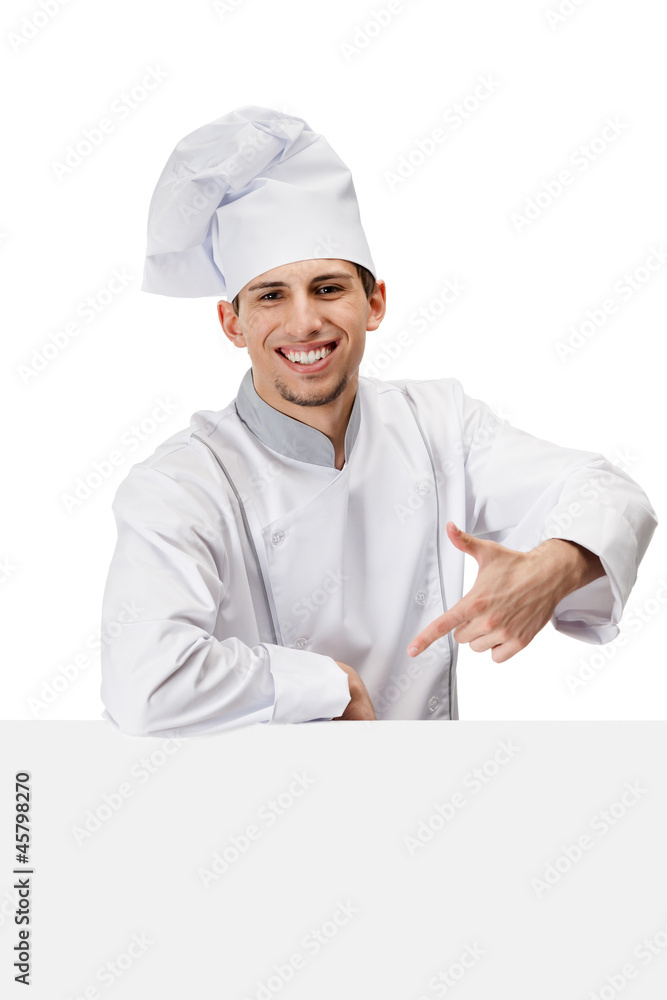 Pointing with forefinger chef cook in uniform, isolated on white Pointing with forefinger chef cook in uniform, isolated on white