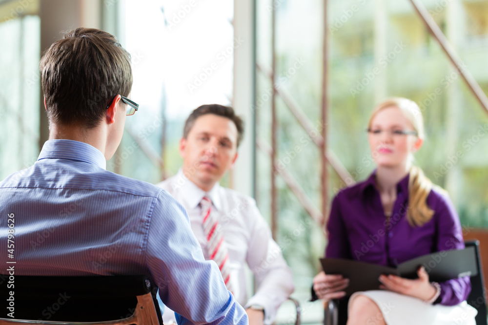 Man having an interview with manager and partner employment job Man having an interview with manager and partner employment job