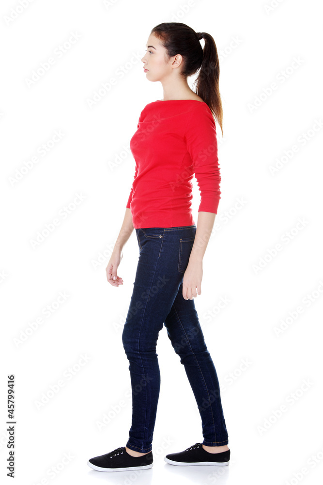 Side view of walking woman Side view of walking woman
