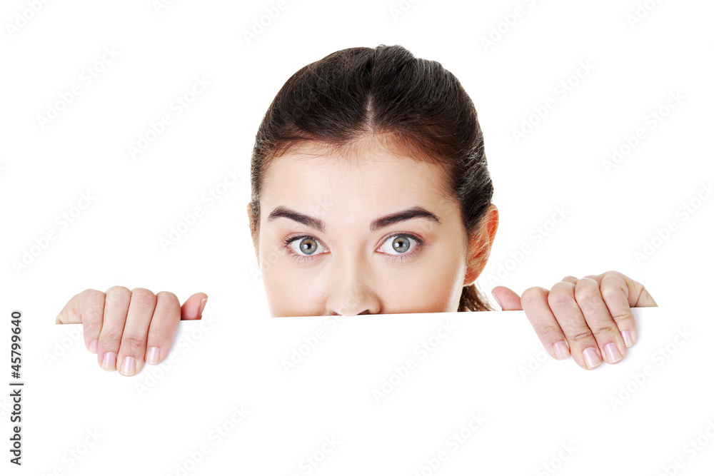 Shocked woman holding blank board Shocked woman holding blank board