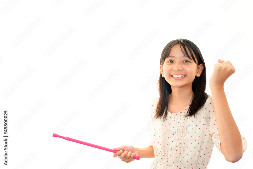 指示棒を持ちガッツポーズをする女の子 指示棒を持ちガッツポーズをする女の子