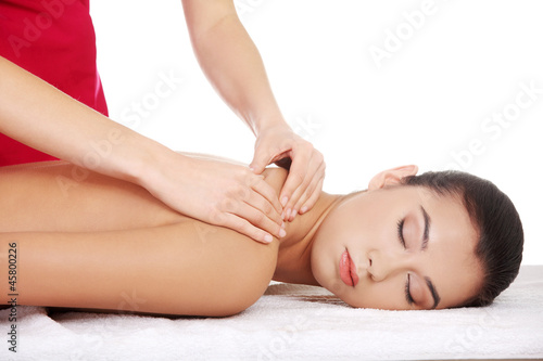 Pretty young woman relaxing being massaged