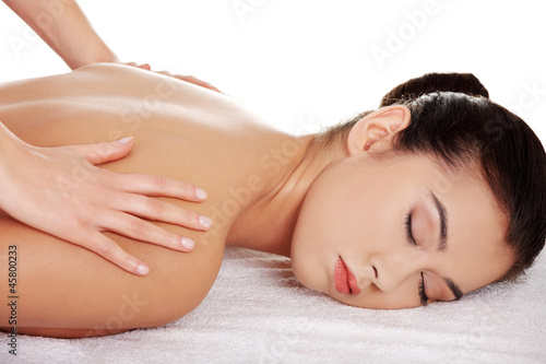 Pretty young woman relaxing being massaged