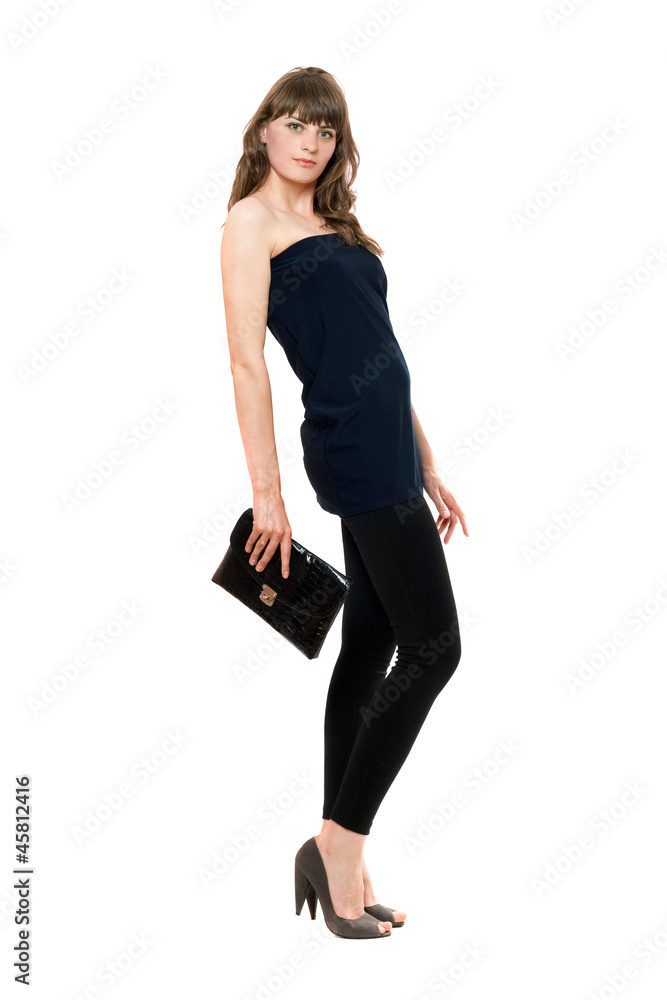 Fototapeta premium Lovely girl in black leggings with a handbag