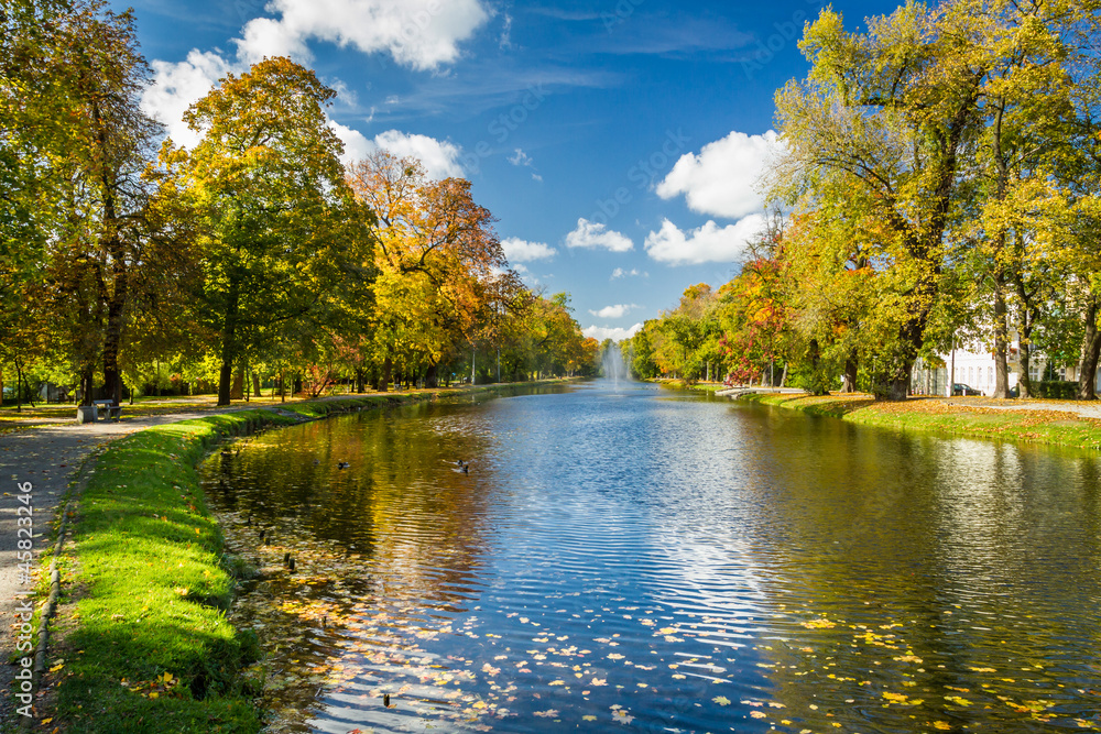Path by the river in the park autumn season Path by the river in the park autumn season