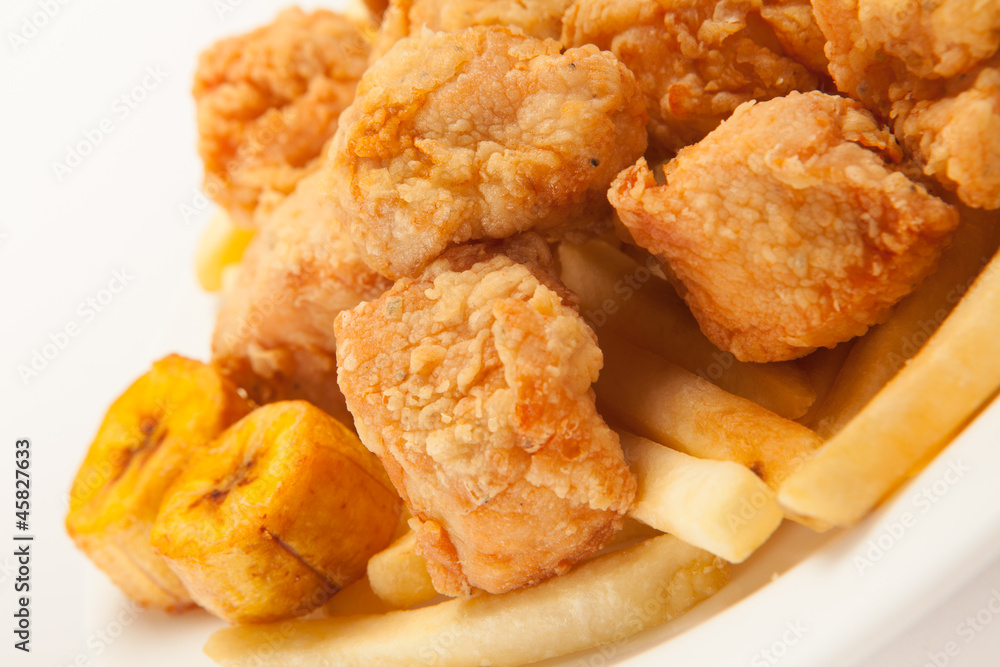 Fried chicken with french fries and banana fries close up Fried chicken with french fries and banana fries close up