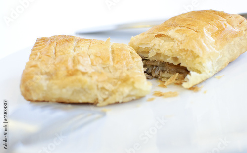 Puff pastry with tuna on white background
