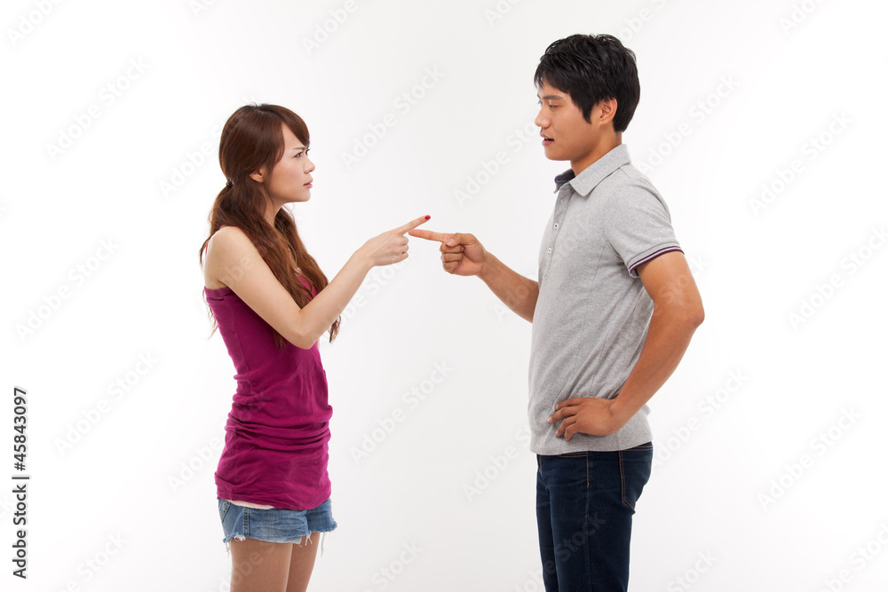 Asian couple fight each other isolated on white background. Asian couple fight each other isolated on white background.