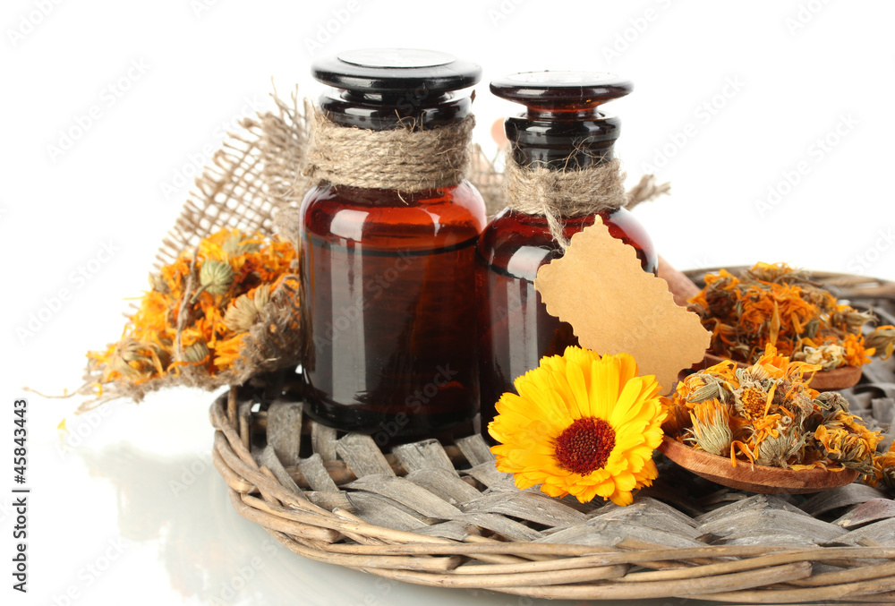 medicine bottles and calendula, isolated on white medicine bottles and calendula, isolated on white