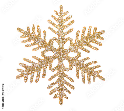 Gold snowflake isolated on white background