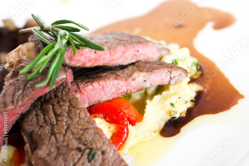 Sirloin beef steak with mashed potato and tomato