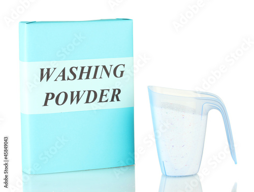 Box of washing powder with blue measuring cup isolated on white
