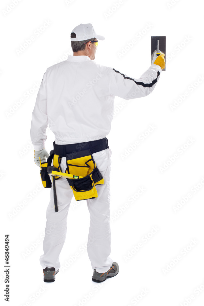 construction worker in white coveralls wall putty trowel hammer