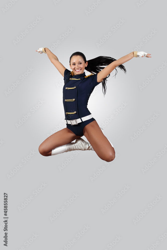 Young female dancer against white background