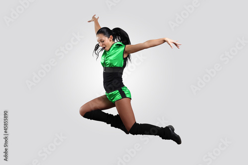 Young female dancer against white background