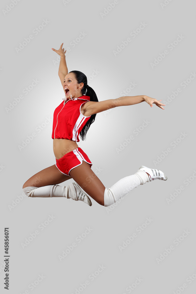 Young female dancer against white background