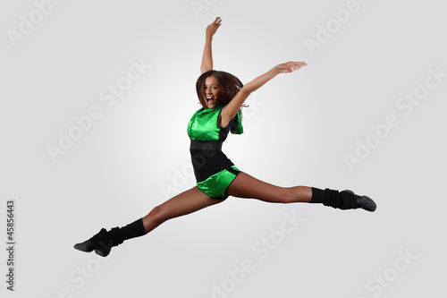 Young female dancer against white background © Sergey Nivens