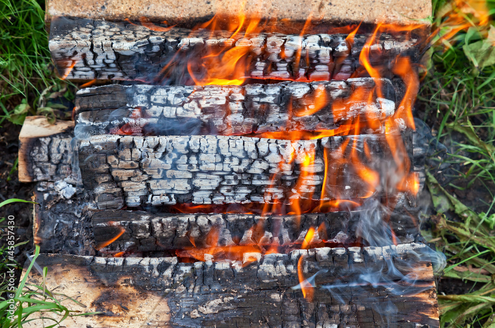 Closeup of a warm fire burning in a bonfire Closeup of a warm fire burning in a bonfire