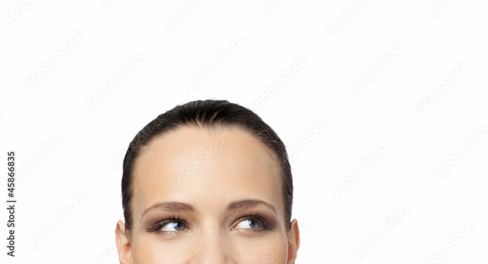 A young woman looking up and thinking deeply A young woman looking up and thinking deeply
