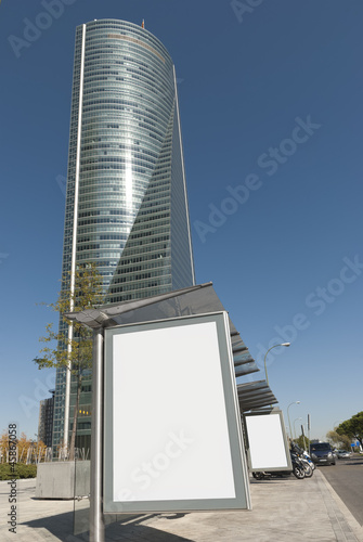 Madrid. Bus Stop Billboard in the City and Skycraper © ddrash