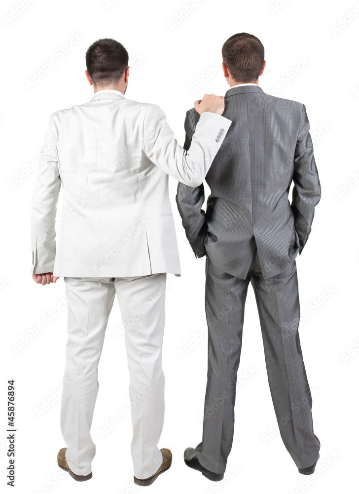 Back view of Two businessmen discuss.
