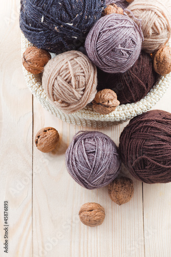 colorful balls of yarn on a wooden table