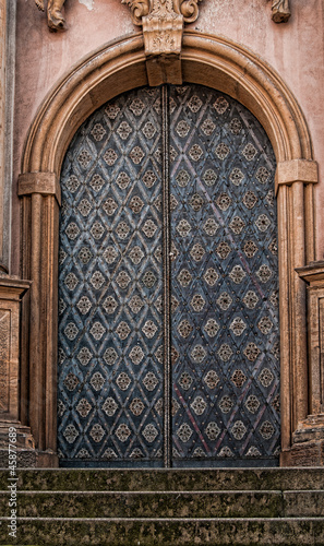 Cast iron doors with stone surround