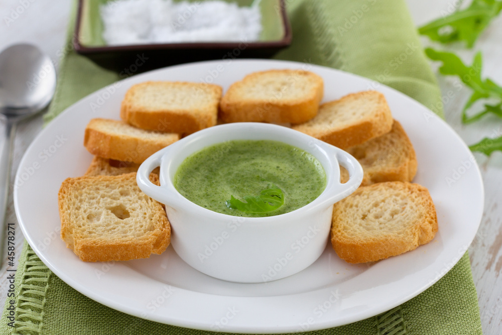 sauce in white bowl with toasts sauce in white bowl with toasts