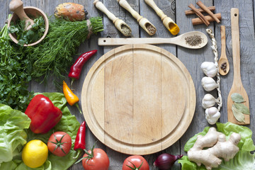 Vegetables and spices vintage border and empty cutting board