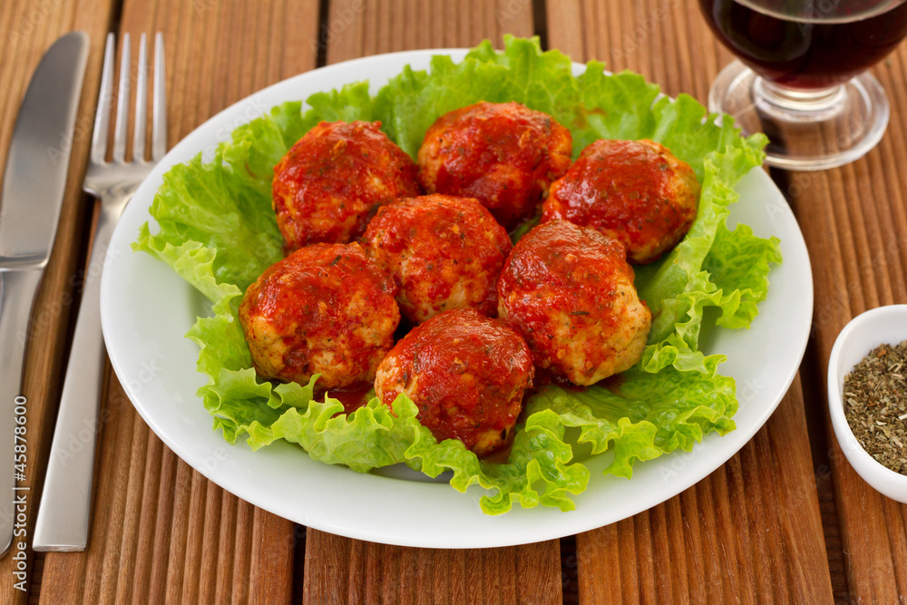 chicken meatballs with tomato sauce on the plate chicken meatballs with tomato sauce on the plate