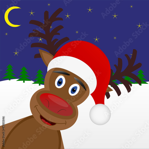 Christmas deer peeks out of the woods