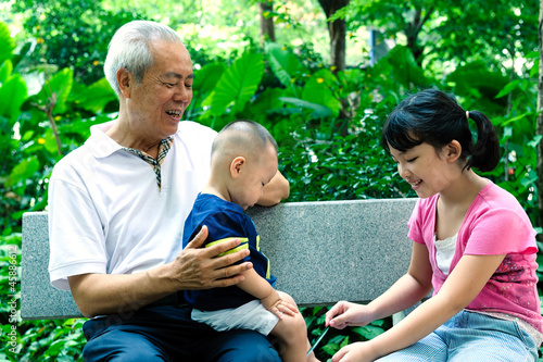 Asian grandfather with two grandchildren © raywoo