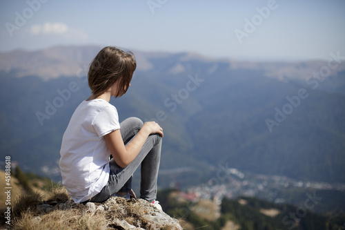 white teenager girl admiring mountains