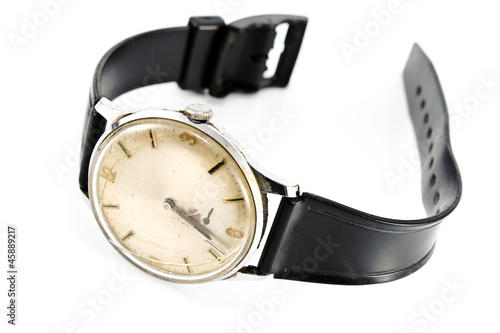 Old broken wristwatch with black strap