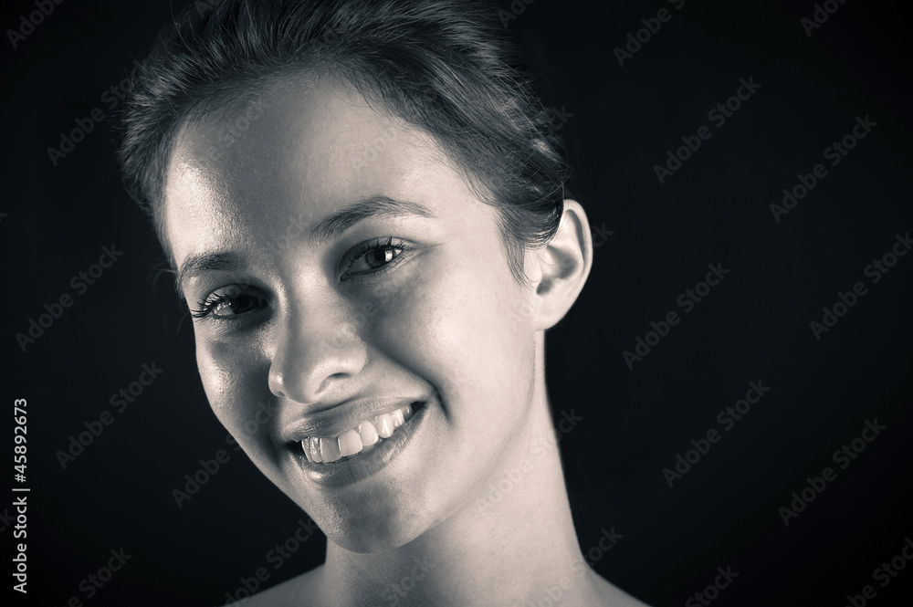 Beautiful smiling woman close up portrait. Black and white image