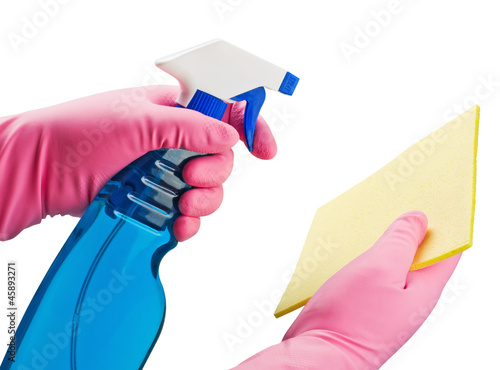 Hand in pink protective glove holding blue transparent spray bot