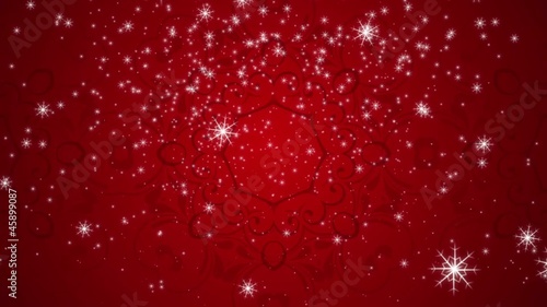 Snowflakes are falling against a red flourish background