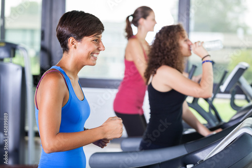 People Running on Treadmill in the Gym