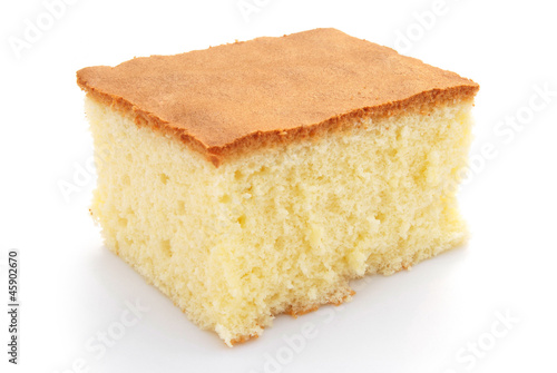 Photo homemade sponge cake on white