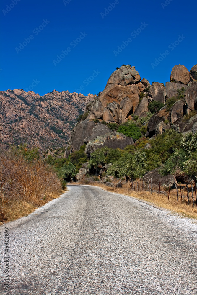 Roadway through unusual rock formations on mountain side
