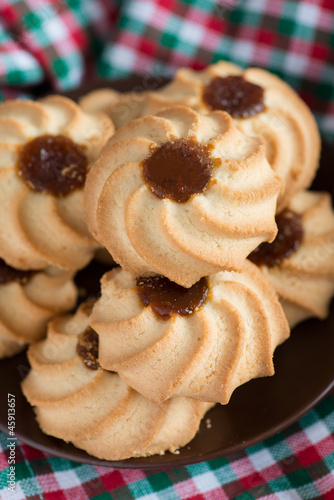 Christmas cookies (kuraby) on plate closeup photo