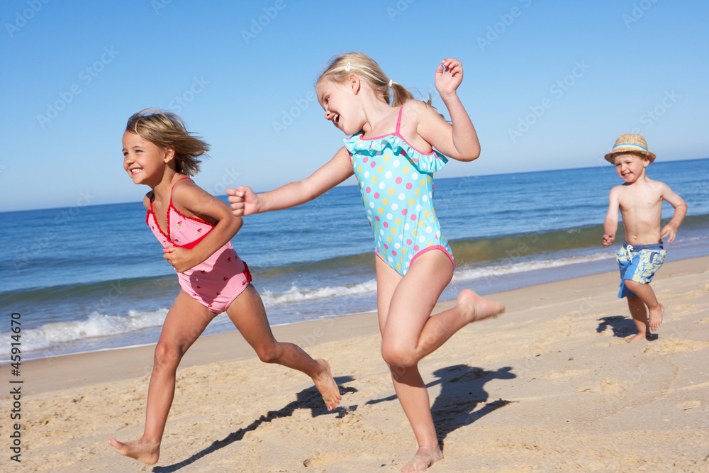 Three Children Running Along Beach Three Children Running Along Beach