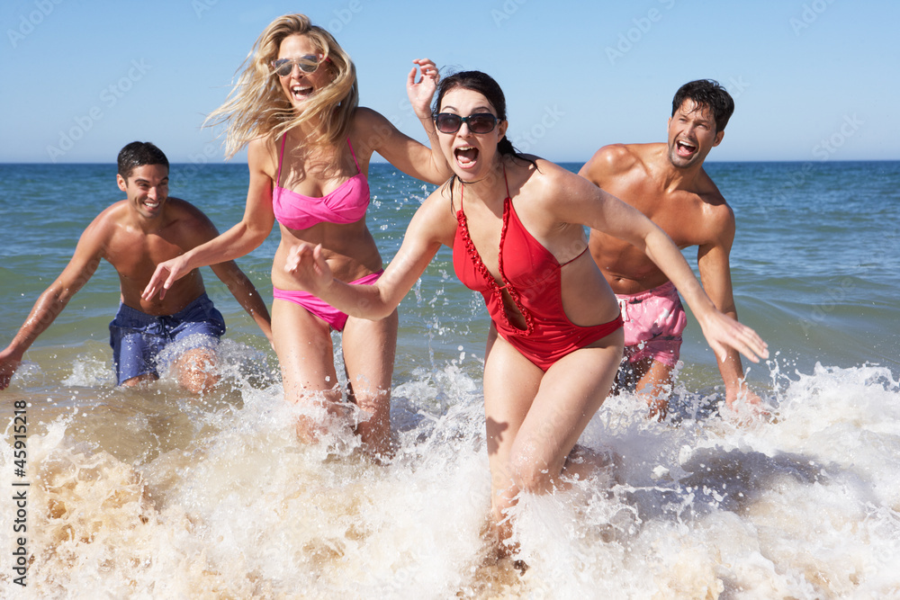Group Of Friends Enjoying Beach Holiday Group Of Friends Enjoying Beach Holiday