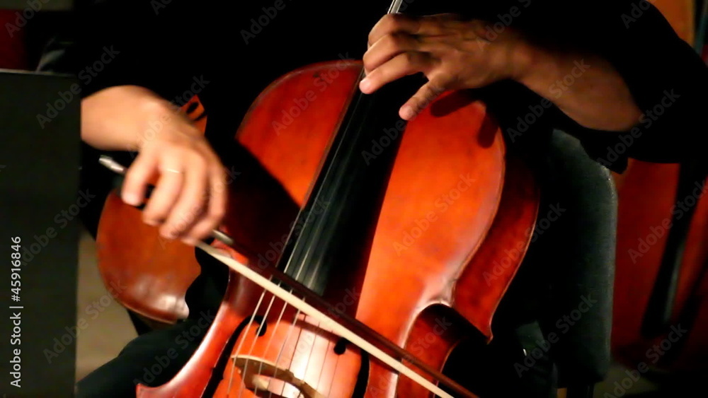 close-up view on violoncello in orchestra close-up view on violoncello in orchestra