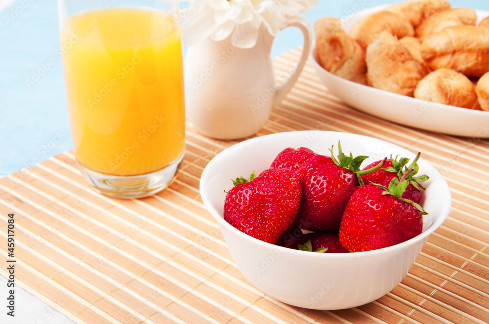 Breakfast with berries,orange juice and croissant Breakfast with berries,orange juice and croissant