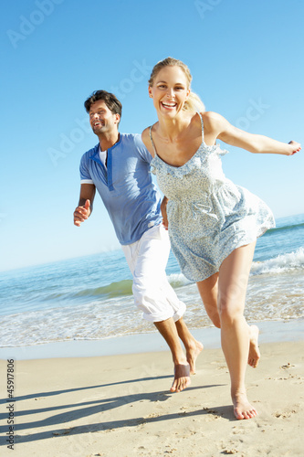 Photography Couple Enjoying Romantic Beach Holiday