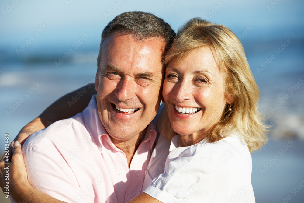 Senior Couple Enjoying Romantic Beach Holiday Senior Couple Enjoying Romantic Beach Holiday