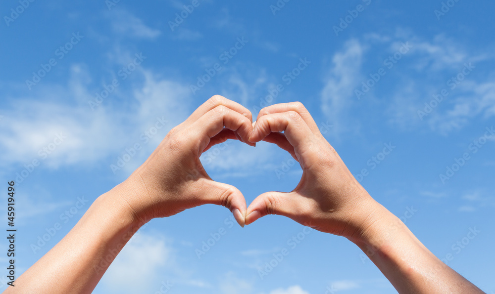 heart of the fingers against the blue sky heart of the fingers against the blue sky