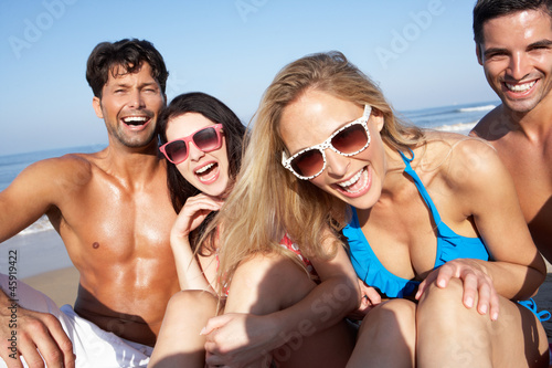 Group Of Friends Enjoying Beach Holiday © Monkey Business