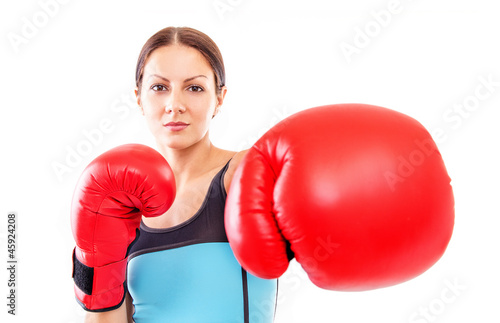 Pretty girl in boxing gloves pose, FOCUS ON FACE